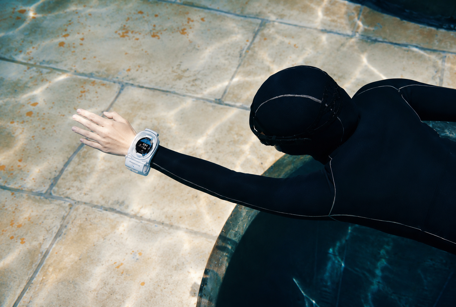 Freediver wearing Watch Dive at the pool edge